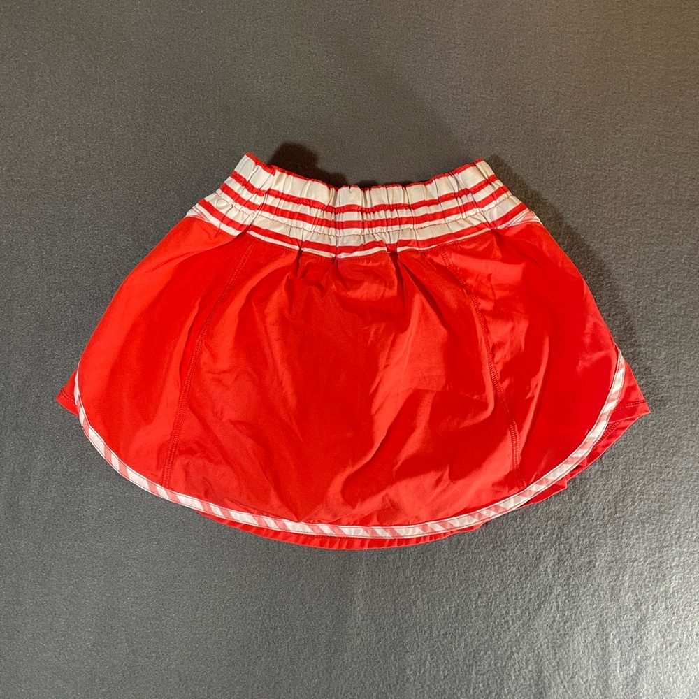 Lululemon Athletica coral skort with White Stripes